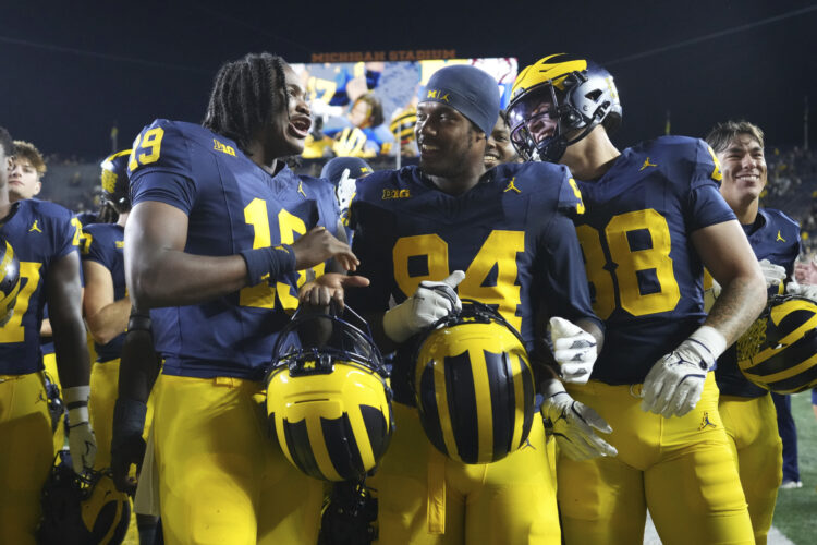Michigan visits Oklahoma on Saturday night